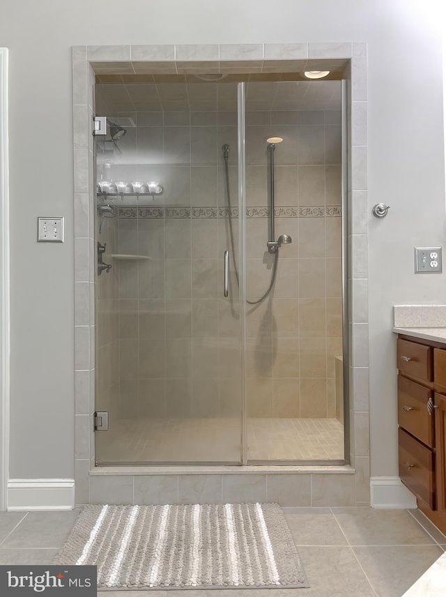 24655 Broad Creek Dr, Hollywood, MD 20636 - full bath with tile patterned flooring, vanity, a shower stall, and baseboards