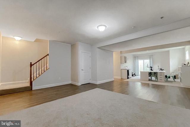 24655 Broad Creek Dr, Hollywood, MD 20636 - unfurnished living room featuring wood finished floors, stairs, and baseboards
