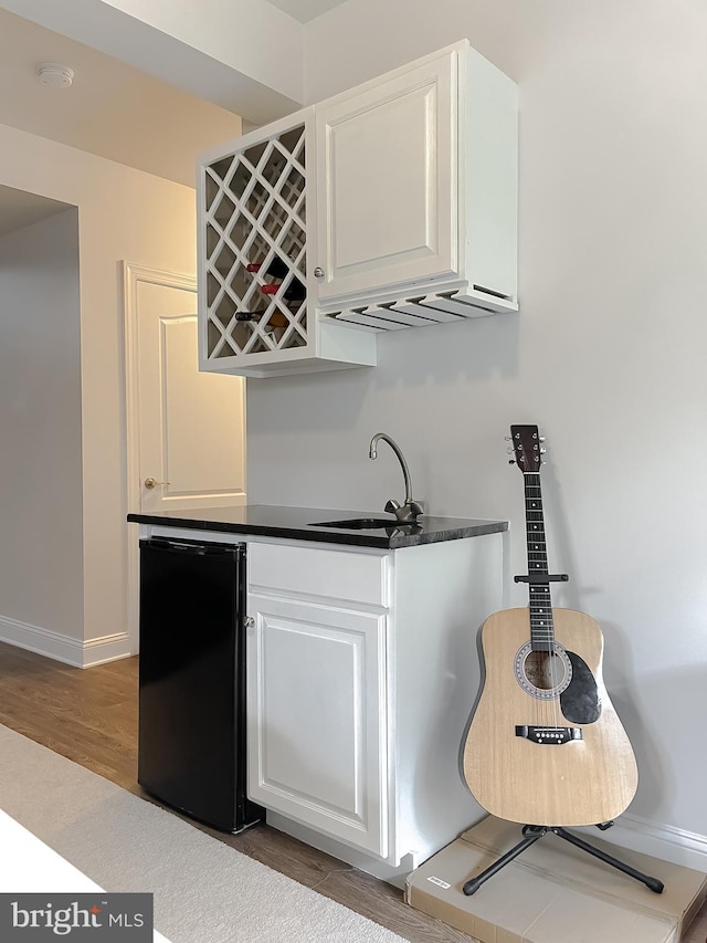 24655 Broad Creek Dr, Hollywood, MD 20636 - indoor wet bar featuring refrigerator, wood finished floors, and baseboards
