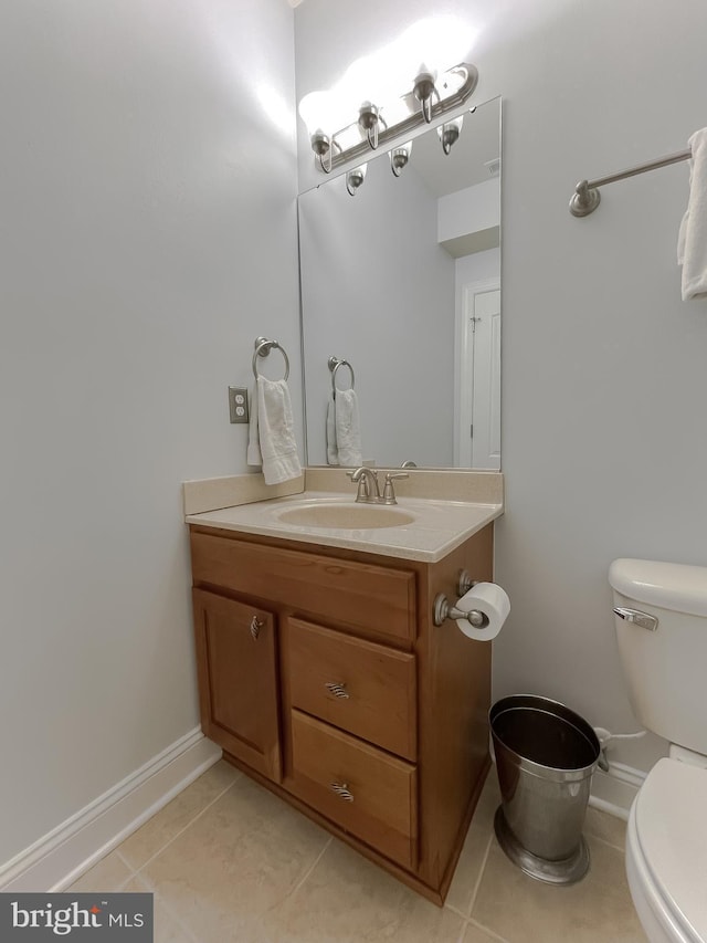 24655 Broad Creek Dr, Hollywood, MD 20636 - half bath with toilet, vanity, tile patterned flooring, and baseboards