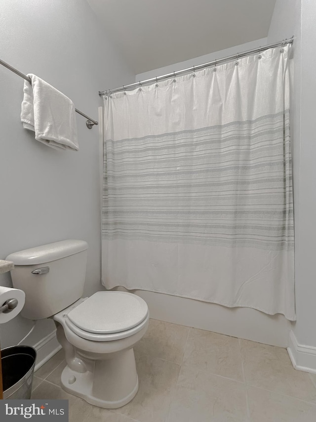 24655 Broad Creek Dr, Hollywood, MD 20636 - full bath with toilet, tile patterned floors, shower / bathtub combination with curtain, lofted ceiling, and baseboards