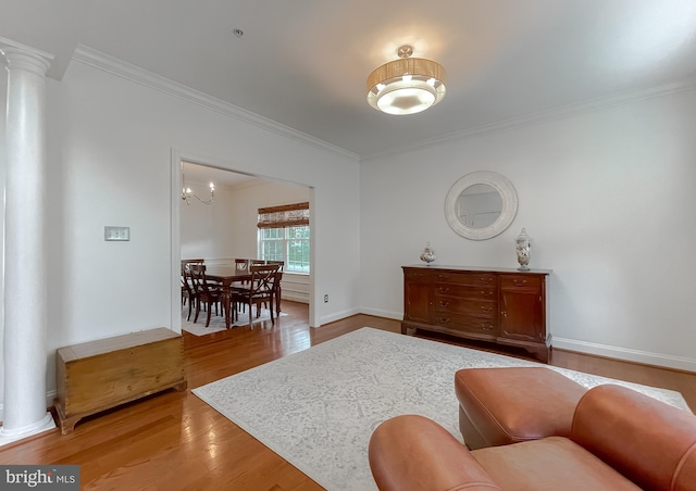 24655 Broad Creek Dr, Hollywood, MD 20636 - sitting room featuring crown molding, ornate columns, light wood finished floors, and baseboards