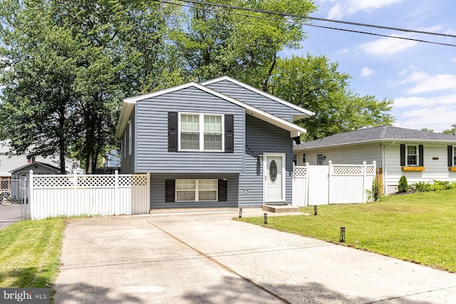 1088 Locust Dr, Pasadena, MD 21122 - split level home featuring concrete driveway