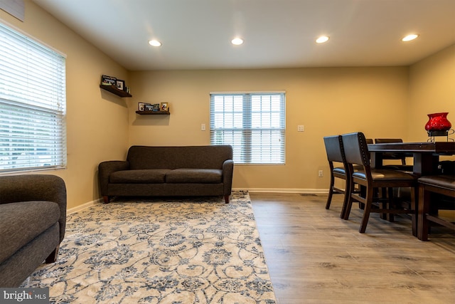 1088 Locust Dr, Pasadena, MD 21122 - living area with healthy amount of natural light, recessed lighting, wood finished floors, and baseboards