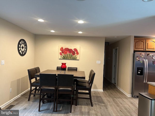 1088 Locust Dr, Pasadena, MD 21122 - dining area featuring light wood finished floors, baseboards, and recessed lighting
