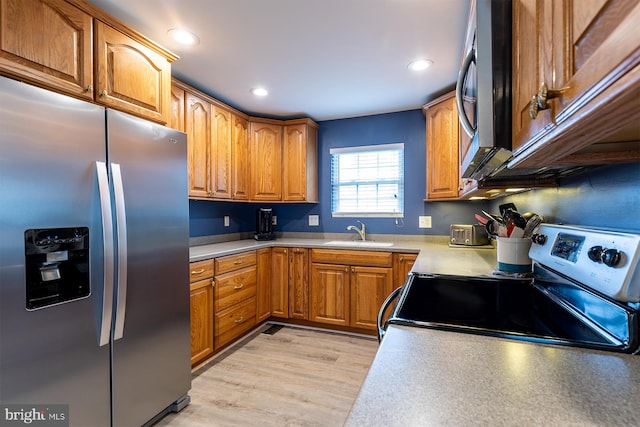 1088 Locust Dr, Pasadena, MD 21122 - kitchen with appliances with stainless steel finishes, a sink, brown cabinetry, light countertops, and recessed lighting