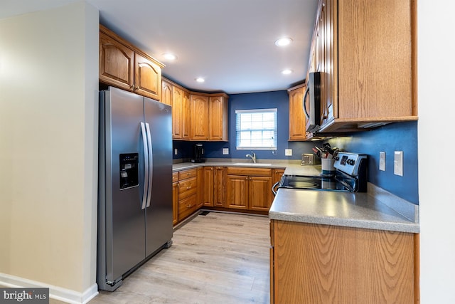 1088 Locust Dr, Pasadena, MD 21122 - kitchen featuring stainless steel refrigerator with ice dispenser, range with electric cooktop, recessed lighting, brown cabinets, and a sink