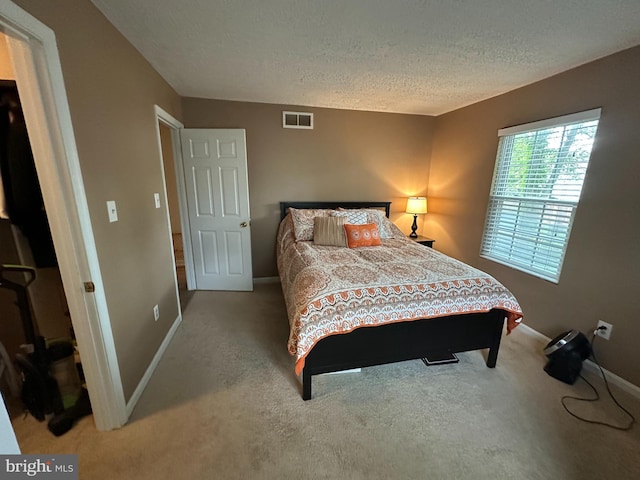 1088 Locust Dr, Pasadena, MD 21122 - bedroom featuring carpet floors, a textured ceiling, and baseboards