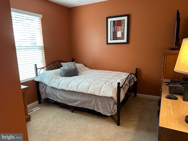 1088 Locust Dr, Pasadena, MD 21122 - bedroom featuring multiple windows, carpet floors, and baseboards