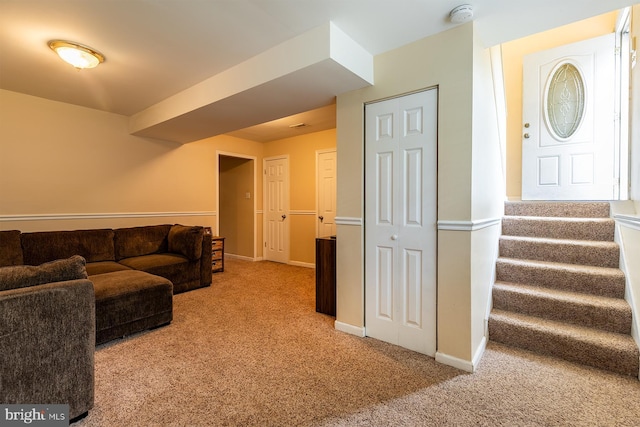1088 Locust Dr, Pasadena, MD 21122 - carpeted living area with stairway and baseboards