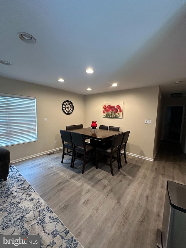 1088 Locust Dr, Pasadena, MD 21122 - dining space with wood finished floors, baseboards, and recessed lighting