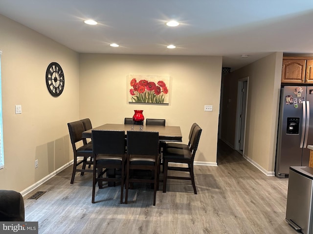 1088 Locust Dr, Pasadena, MD 21122 - dining space featuring light wood-style floors, recessed lighting, and baseboards