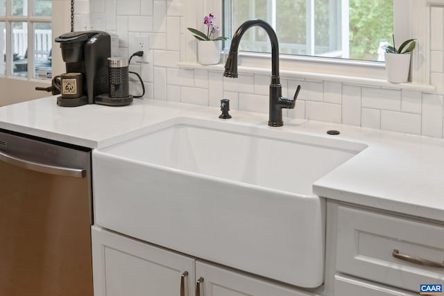 3500 Monacan Dr W, Charlottesville, VA 22901 - kitchen with stainless steel dishwasher, a sink, decorative backsplash, and healthy amount of natural light