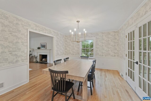 3500 Monacan Dr W, Charlottesville, VA 22901 - dining space featuring a wainscoted wall, a chandelier, a fireplace, wallpapered walls, and wood finished floors