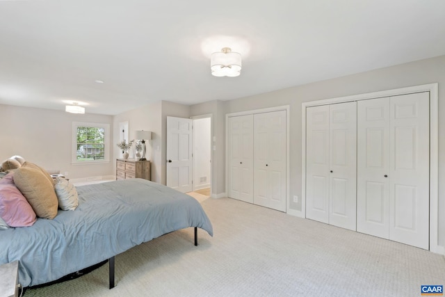 3500 Monacan Dr W, Charlottesville, VA 22901 - bedroom with multiple closets, light carpet, and baseboards