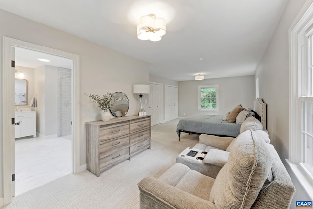 3500 Monacan Dr W, Charlottesville, VA 22901 - bedroom with ensuite bathroom, baseboards, and light marble finish floors