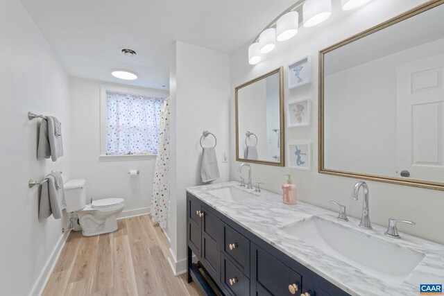 3500 Monacan Dr W, Charlottesville, VA 22901 - full bathroom featuring toilet, wood finished floors, double vanity, baseboards, and a shower with curtain