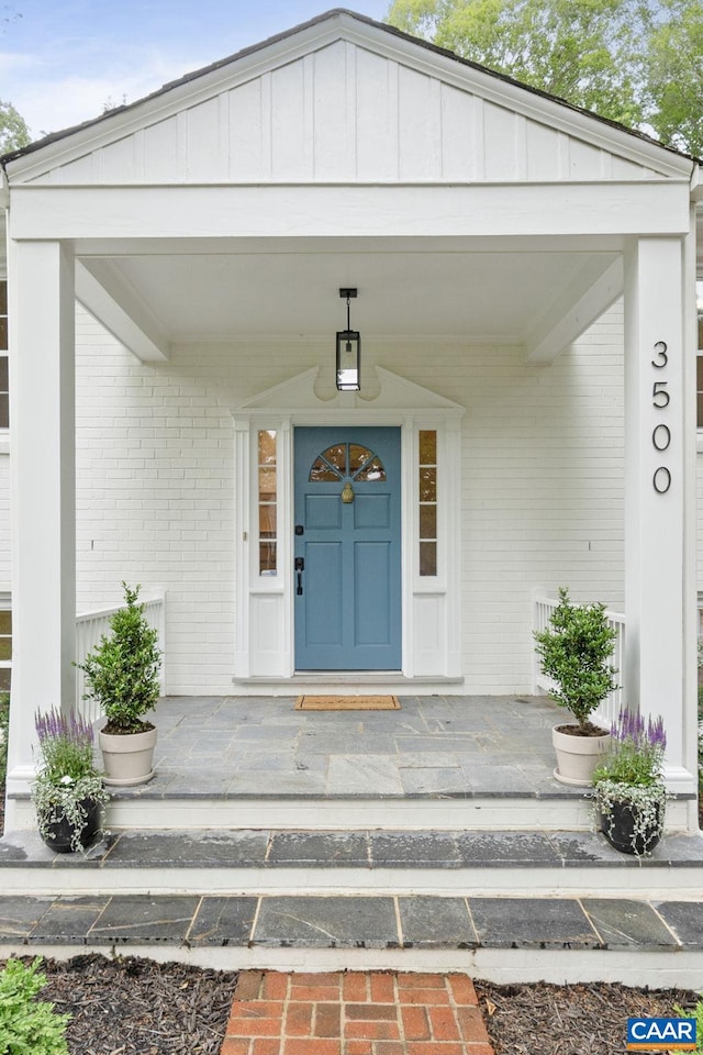 3500 Monacan Dr W, Charlottesville, VA 22901 - property entrance with brick siding, board and batten siding, and a porch