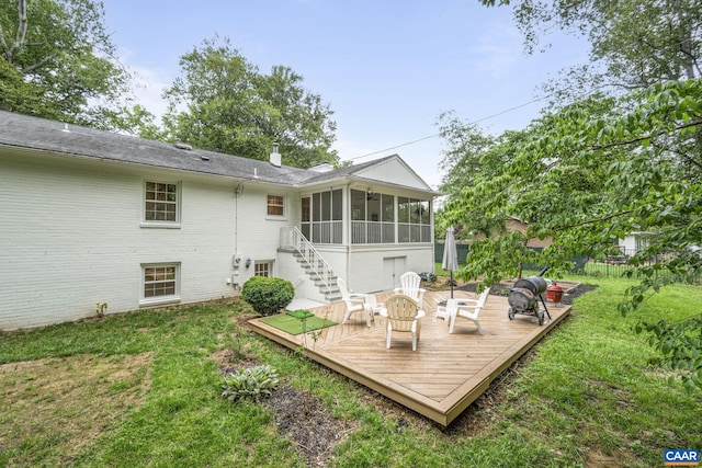 3500 Monacan Dr W, Charlottesville, VA 22901 - rear view of house featuring a sunroom, brick siding, a wooden deck, a yard, and stairway
