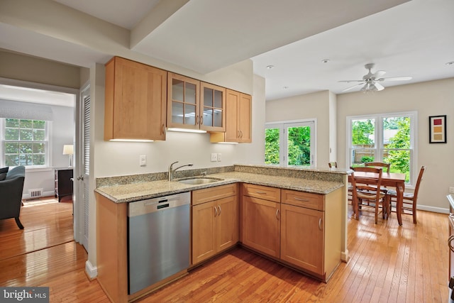 5613 Glenwood Rd, Bethesda, MD 20817 - kitchen featuring dishwasher, a sink, light wood-type flooring, and light stone countertops