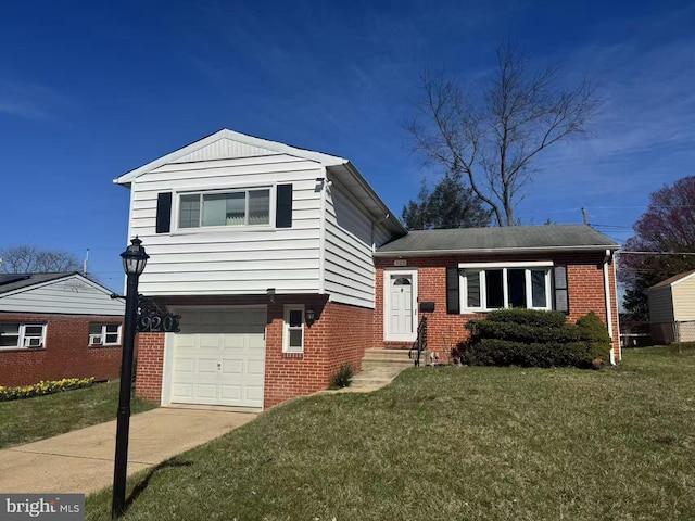 920 Vanderwood, Baltimore, MD 21228 - tri-level home with brick siding, a garage, a front lawn, and driveway