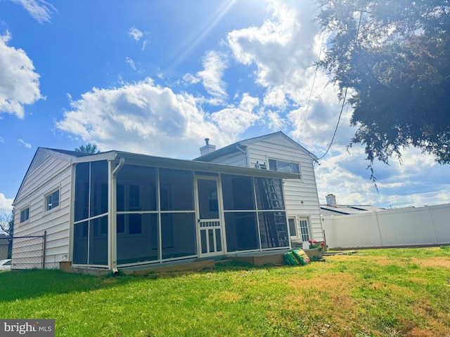 920 Vanderwood, Baltimore, MD 21228 - rear view of property featuring a sunroom and a chimney