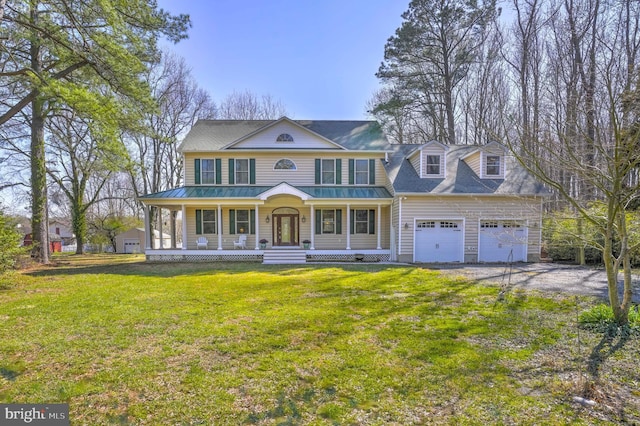 1109 Cherry Point Rd, West River, MD 20778 - view of front of property featuring covered porch, a front lawn, driveway, and an attached garage