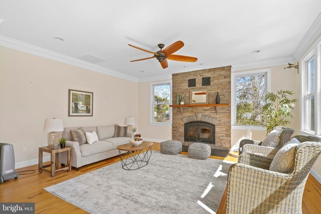 1109 Cherry Point Rd, West River, MD 20778 - living room featuring a ceiling fan, wood finished floors, crown molding, baseboards, and a fireplace