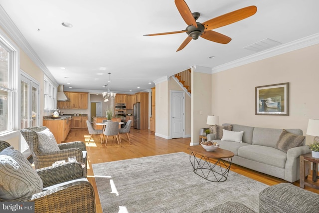 1109 Cherry Point Rd, West River, MD 20778 - living room with ornamental molding, light wood-type flooring, a chandelier, ceiling fan, and recessed lighting