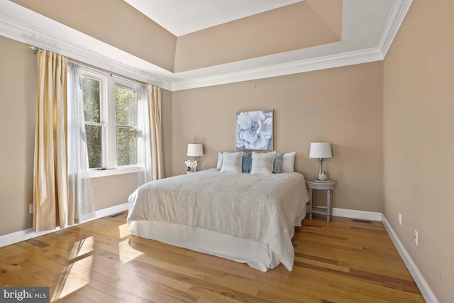 1109 Cherry Point Rd, West River, MD 20778 - bedroom with wood finished floors, baseboards, ornamental molding, and a raised ceiling
