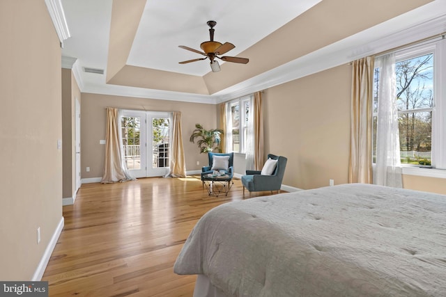 1109 Cherry Point Rd, West River, MD 20778 - bedroom featuring access to outside, baseboards, a tray ceiling, wood finished floors, and ornamental molding