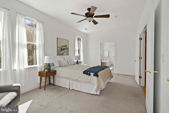 1109 Cherry Point Rd, West River, MD 20778 - bedroom featuring light colored carpet, baseboards, connected bathroom, and ceiling fan