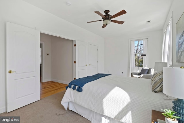 1109 Cherry Point Rd, West River, MD 20778 - bedroom with baseboards, a ceiling fan, and light carpet