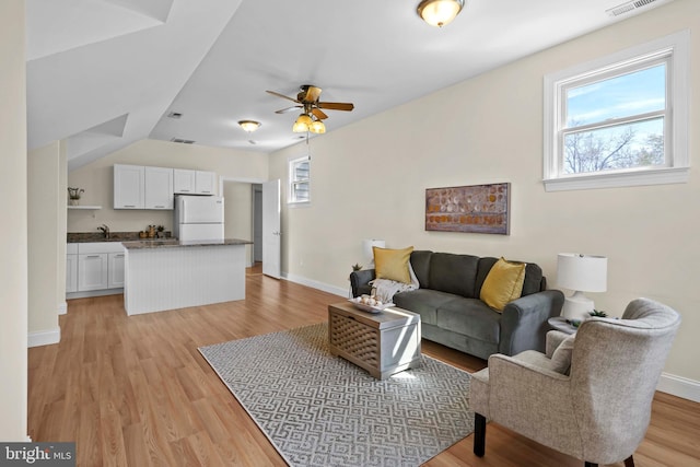 1109 Cherry Point Rd, West River, MD 20778 - living room with baseboards, light wood-style flooring, and ceiling fan
