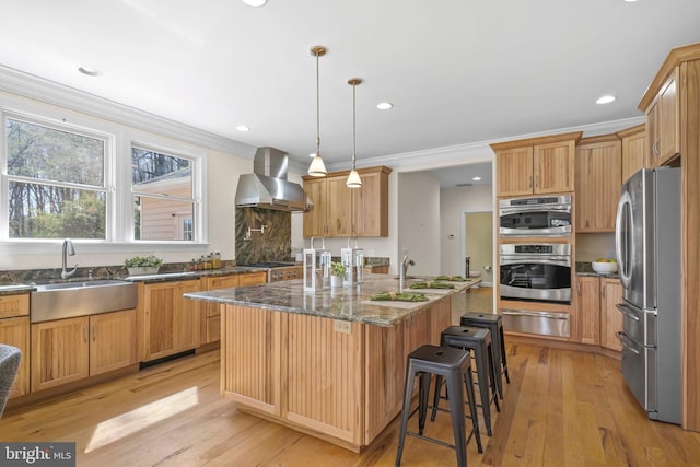 1109 Cherry Point Rd, West River, MD 20778 - kitchen with wall chimney range hood, freestanding refrigerator, a sink, a warming drawer, and a kitchen bar