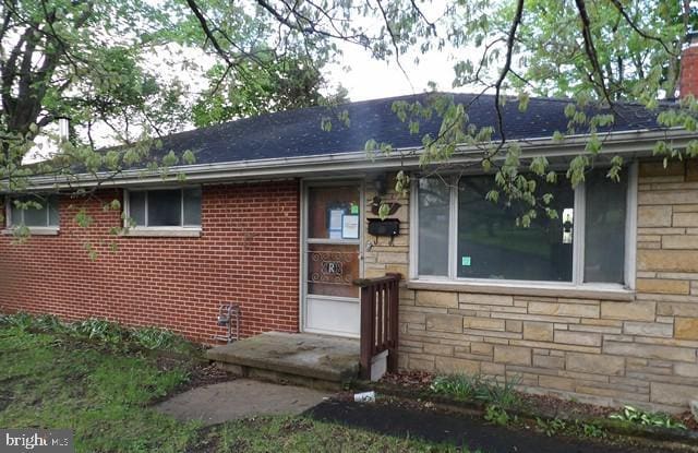 179 Mount Pleasant St, Frostburg, MD 21532 - view of front facade featuring stone siding