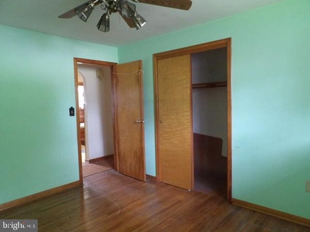179 Mount Pleasant St, Frostburg, MD 21532 - unfurnished bedroom with a closet, wood finished floors, baseboards, and a ceiling fan