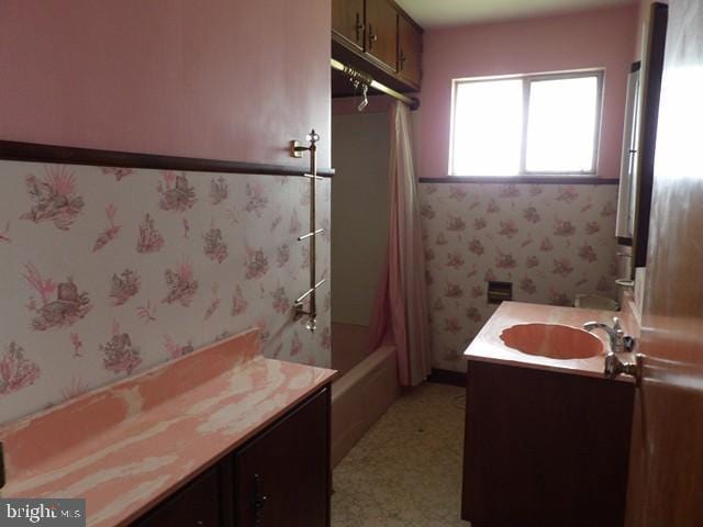 179 Mount Pleasant St, Frostburg, MD 21532 - bathroom with vanity, shower / bathtub combination with curtain, and wallpapered walls