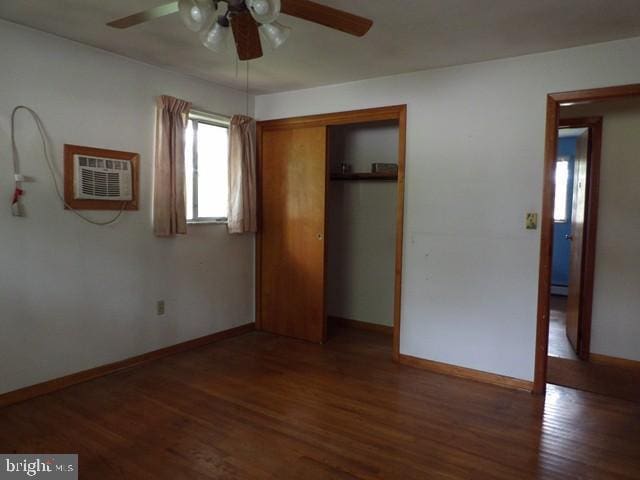 179 Mount Pleasant St, Frostburg, MD 21532 - unfurnished bedroom with wood finished floors, a closet, baseboards, a baseboard heating unit, and a ceiling fan