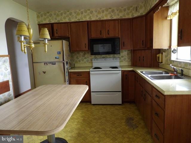 179 Mount Pleasant St, Frostburg, MD 21532 - kitchen featuring white appliances, a sink, light countertops, tile patterned floors, and tasteful backsplash