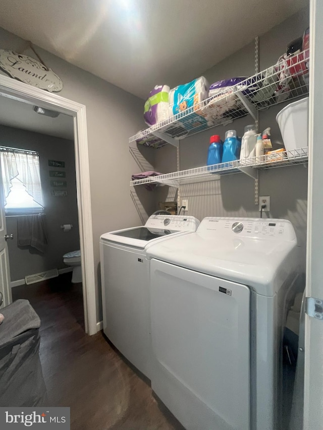 127 Greenwich Ave, Paulsboro, NJ 08066 - washroom featuring washing machine and clothes dryer, wood finished floors, and baseboards