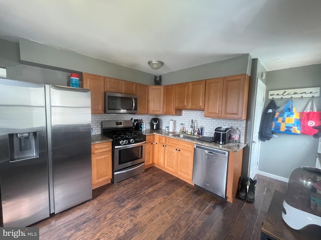 127 Greenwich Ave, Paulsboro, NJ 08066 - kitchen with stainless steel appliances, a sink, stone countertops, and dark wood-type flooring