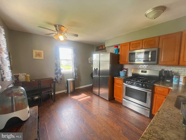 127 Greenwich Ave, Paulsboro, NJ 08066 - kitchen featuring appliances with stainless steel finishes, tasteful backsplash, a ceiling fan, dark wood finished floors, and baseboards