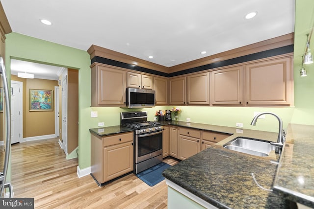 1319 Gwynedale Way, Lansdale, PA 19446 - kitchen featuring appliances with stainless steel finishes, a sink, light wood-type flooring, ornamental molding, and baseboards