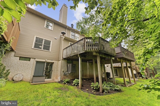 1319 Gwynedale Way, Lansdale, PA 19446 - back of house with a yard, a wooden deck, a chimney, and stucco siding