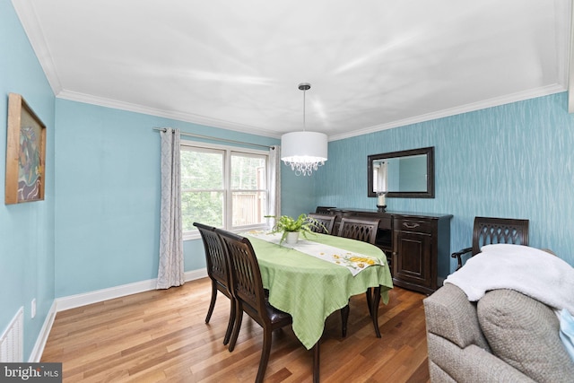 1319 Gwynedale Way, Lansdale, PA 19446 - dining space featuring light wood-type flooring, a chandelier, wallpapered walls, ornamental molding, and baseboards