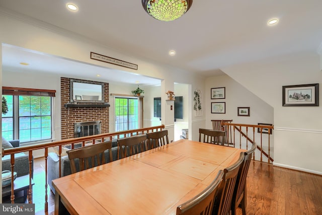 23 Faraday Dr, Lutherville Timonium, MD 21093 - dining space with plenty of natural light, wood finished floors, recessed lighting, crown molding, and a fireplace