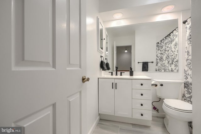 23 Faraday Dr, Lutherville Timonium, MD 21093 - bathroom featuring vanity, toilet, baseboards, and curtained shower