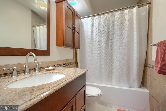 23 Faraday Dr, Lutherville Timonium, MD 21093 - bathroom featuring vanity, shower / tub combo with curtain, toilet, decorative backsplash, and tile walls