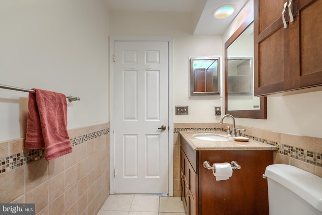 23 Faraday Dr, Lutherville Timonium, MD 21093 - bathroom featuring tile walls, vanity, tile patterned flooring, a wainscoted wall, and toilet